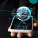 A digital holographic globe emerging from a smartphone, symbolizing AI-powered news verification and global information flow.